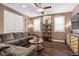 Comfortable living room featuring a large sectional sofa, natural light and modern decor at 8013 Green River Knob St, Las Vegas, NV 89113