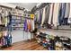 Spacious walk-in closet with custom shelving and ample storage for shoes and clothing at 8013 Green River Knob St, Las Vegas, NV 89113