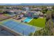 A panoramic aerial perspective of a home with a pool, tennis court, and outdoor entertainment spaces at 8228 Fulton Ranch St, Las Vegas, NV 89131