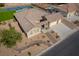 Beautiful home with a three car garage and desert landscaping, featuring rock accents and native plants at 8228 Fulton Ranch St, Las Vegas, NV 89131