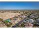 Expansive aerial view of a residential neighborhood with community amenities and a desert backdrop at 8228 Fulton Ranch St, Las Vegas, NV 89131