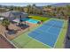 Overhead view of a property featuring a pool, tennis court, gazebo and mature landscaping at 8228 Fulton Ranch St, Las Vegas, NV 89131