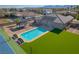The backyard offers a pool, tennis court, gazebo, and green grass, providing a private retreat at 8228 Fulton Ranch St, Las Vegas, NV 89131
