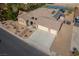 Beautiful home with a three car garage, desert landscaping, and inviting walkway to the front door at 8228 Fulton Ranch St, Las Vegas, NV 89131