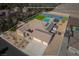 Beautiful home featuring a tennis court, pool, desert landscaping, and a three car garage at 8228 Fulton Ranch St, Las Vegas, NV 89131