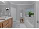 Neutral bathroom featuring double vanity, shower, tub, stool, and modern fixtures with great lighting at 8228 Fulton Ranch St, Las Vegas, NV 89131