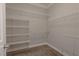 The closet features a carpeted floor and a white shelving system at 8228 Fulton Ranch St, Las Vegas, NV 89131