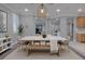 Spacious dining room with lots of natural light and access to other rooms offers an inviting area to entertain at 8228 Fulton Ranch St, Las Vegas, NV 89131