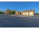 Beautifully maintained single-story home with a three-car garage, complemented by desert landscaping at 8228 Fulton Ranch St, Las Vegas, NV 89131