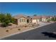 Aerial view of charming home with low-maintenance desert landscaping and a three-car garage at 8228 Fulton Ranch St, Las Vegas, NV 89131