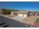 Charming single-story home with a three-car garage, desert landscaping, and mountain views at 8228 Fulton Ranch St, Las Vegas, NV 89131