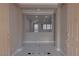 Open-concept foyer showcasing a glimpse of the living area and abundant natural light at 8228 Fulton Ranch St, Las Vegas, NV 89131
