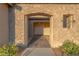 Close up of stone facade framing front door, offering architectural detail and curb appeal at 8228 Fulton Ranch St, Las Vegas, NV 89131