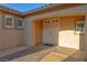 Covered front porch featuring a double-door entry and decorative tile flooring at 8228 Fulton Ranch St, Las Vegas, NV 89131
