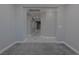 Hallway with gray walls, white trim and doors, with carpet and tile flooring at 8228 Fulton Ranch St, Las Vegas, NV 89131