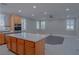 The open kitchen flows into a large living area with natural light at 8228 Fulton Ranch St, Las Vegas, NV 89131
