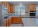 Beautiful kitchen features stainless appliances, granite countertops, and a bright window at 8228 Fulton Ranch St, Las Vegas, NV 89131
