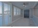 This living room features white shutters on the windows with a tile floor at 8228 Fulton Ranch St, Las Vegas, NV 89131