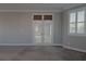 Carpeted main bedroom has French doors and window shutters at 8228 Fulton Ranch St, Las Vegas, NV 89131