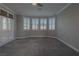 A neutral main bedroom with shutters and carpeted floors at 8228 Fulton Ranch St, Las Vegas, NV 89131