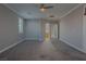 Spacious carpeted main bedroom with a ceiling fan and ensuite bath at 8228 Fulton Ranch St, Las Vegas, NV 89131