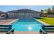 Backyard pool offers a tranquil oasis, beautifully integrated with the home's exterior and manicured lawn at 8228 Fulton Ranch St, Las Vegas, NV 89131