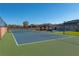 Backyard area with full-size tennis court, pool, gazebo, artificial grass, and block wall at 8228 Fulton Ranch St, Las Vegas, NV 89131