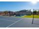 Backyard featuring a pool, gazebo, tennis court and artificial grass in a well-maintained outdoor living space at 8228 Fulton Ranch St, Las Vegas, NV 89131