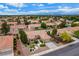 Picture of neighborhood with mature trees and well-maintained landscaping and red tile roofs at 8525 Festival Dr, Las Vegas, NV 89134