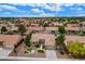 Picture of neighborhood with mature trees and well-maintained landscaping and red tile roofs at 8525 Festival Dr, Las Vegas, NV 89134