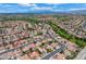 This aerial view shows a large neighborhood filled with mature trees and beautiful landscaping at 8525 Festival Dr, Las Vegas, NV 89134