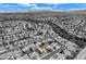 An aerial view of a one-story home in a well-planned community with pristine streets and landscaping at 8525 Festival Dr, Las Vegas, NV 89134