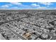 A scenic aerial view of a community featuring a one-story home with a clean roof and neighborhood streets at 8525 Festival Dr, Las Vegas, NV 89134