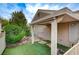 Cozy backyard featuring artificial turf, a covered patio, and low-maintenance desert landscaping at 8525 Festival Dr, Las Vegas, NV 89134