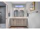 Bright bathroom featuring double sinks, modern vanity, and stylish lighting at 8525 Festival Dr, Las Vegas, NV 89134