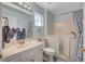 Bathroom featuring a walk-in tub with shower, a vanity, and tiled floors at 8525 Festival Dr, Las Vegas, NV 89134