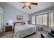 Vaulted ceiling Primary bedroom with bay window and bench seating offers a serene retreat at 8525 Festival Dr, Las Vegas, NV 89134