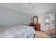 Comfortable bedroom with patterned quilt, dresser, and ceiling fan for a relaxing retreat at 8525 Festival Dr, Las Vegas, NV 89134