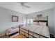 Cozy bedroom featuring a queen-sized bed, a chaise lounge, and a bright window at 8525 Festival Dr, Las Vegas, NV 89134