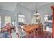 Dining room features a spacious table and decor, with a view into the living room and kitchen at 8525 Festival Dr, Las Vegas, NV 89134