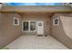 Welcoming front entryway with covered porch, tiled flooring, and an attractive front door at 8525 Festival Dr, Las Vegas, NV 89134