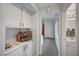 Hallway with built in cabinets with decorative displays, and access to bathroom and bedroom at 8525 Festival Dr, Las Vegas, NV 89134