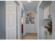 Hallway with doors, decor, and built in cabinets with decorative displays at 8525 Festival Dr, Las Vegas, NV 89134