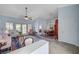 Spacious living room with dining area, featuring vaulted ceilings, stylish décor, and abundant natural light at 8525 Festival Dr, Las Vegas, NV 89134