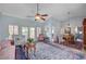 Spacious living room featuring vaulted ceilings, elegant decor, and a decorative area rug at 8525 Festival Dr, Las Vegas, NV 89134