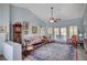 Cozy living room boasting vaulted ceilings, a ceiling fan, stylish furnishings and backyard access at 8525 Festival Dr, Las Vegas, NV 89134