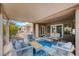 Cozy covered patio with comfortable seating arrangements, ideal for relaxing at 8525 Festival Dr, Las Vegas, NV 89134