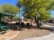 Charming community park with picnic benches and lush landscaping, ideal for outdoor gatherings and relaxation at 8688 Tomnitz Ave # 101, Las Vegas, NV 89178
