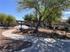 Picturesque park scene with a walking path, mature trees, a picnic gazebo, and nearby residences at 8688 Tomnitz Ave # 101, Las Vegas, NV 89178
