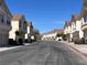 A quiet residential street lined with well-maintained townhomes and mature trees at 8688 Tomnitz Ave # 101, Las Vegas, NV 89178
